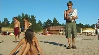 A Young And Stunning Girl Disrobes And Enjoys Herself At The Beach